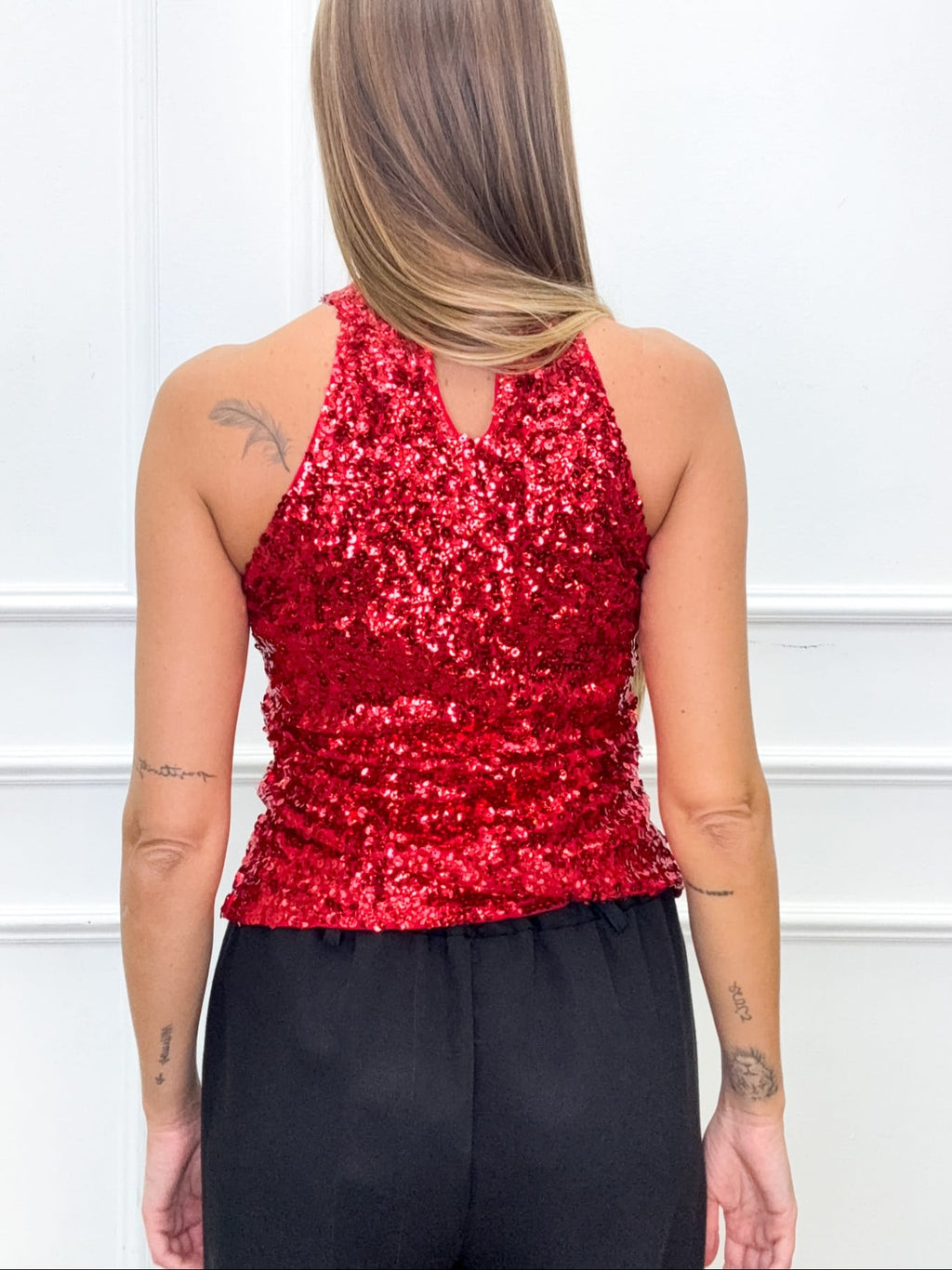 Top elegante con paillette